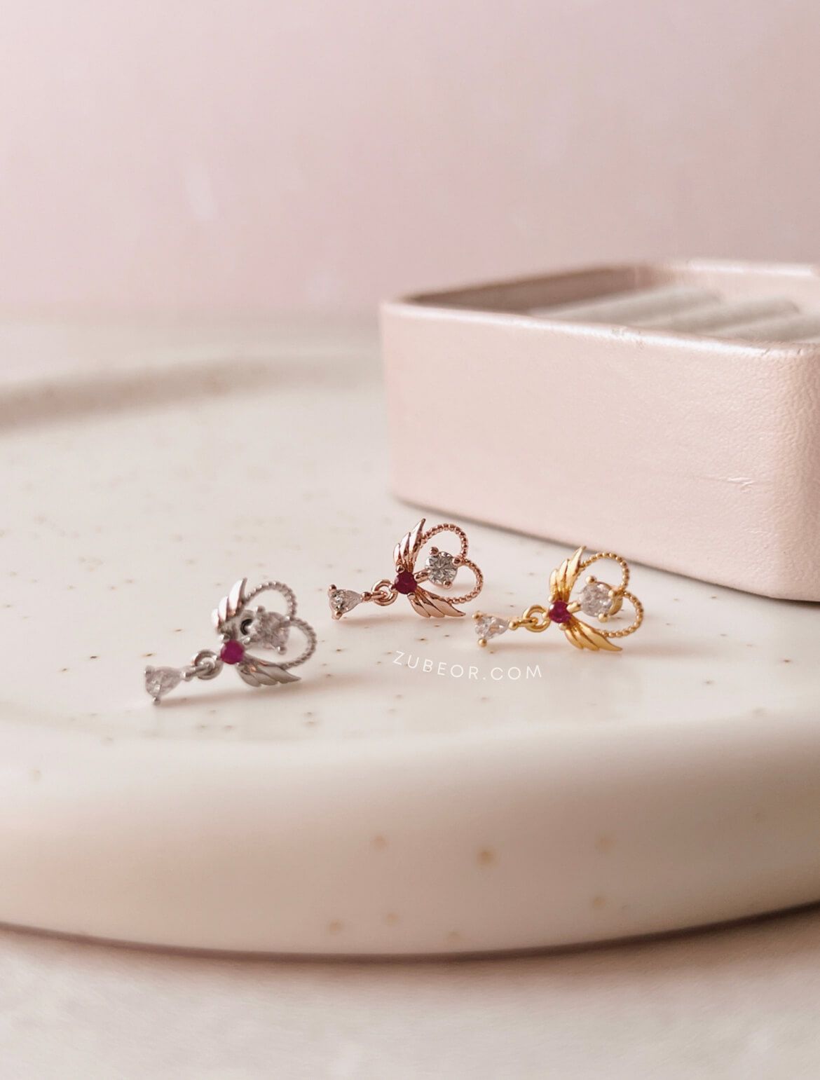 Piercing corazón alas